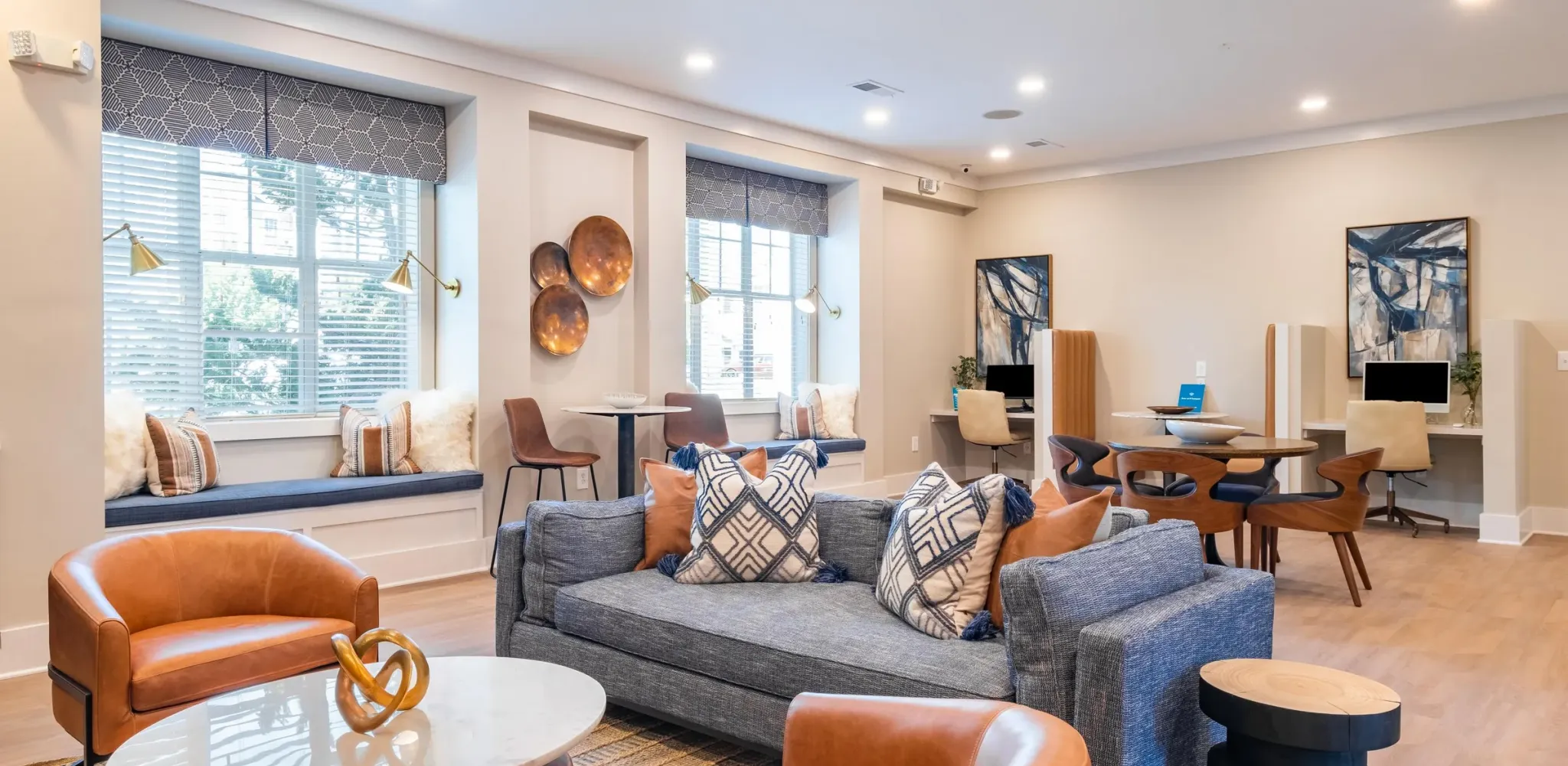 Hawthorne at the Greene apartments resident clubhouse with seating.